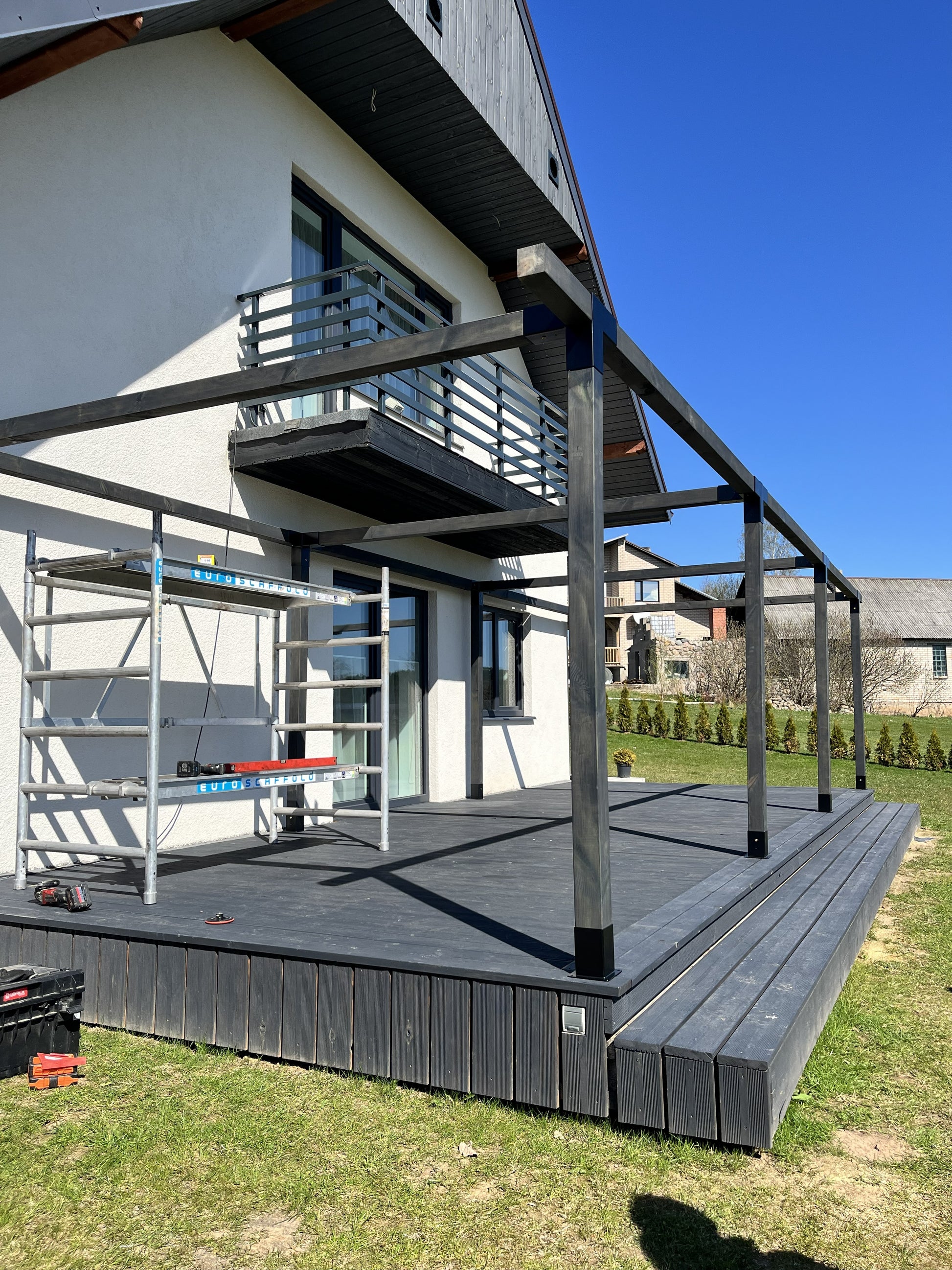 Modular DIY canopy by Terases, 10m x 4.5m, featuring metal framework and fabric roof for outdoor shade and protection.