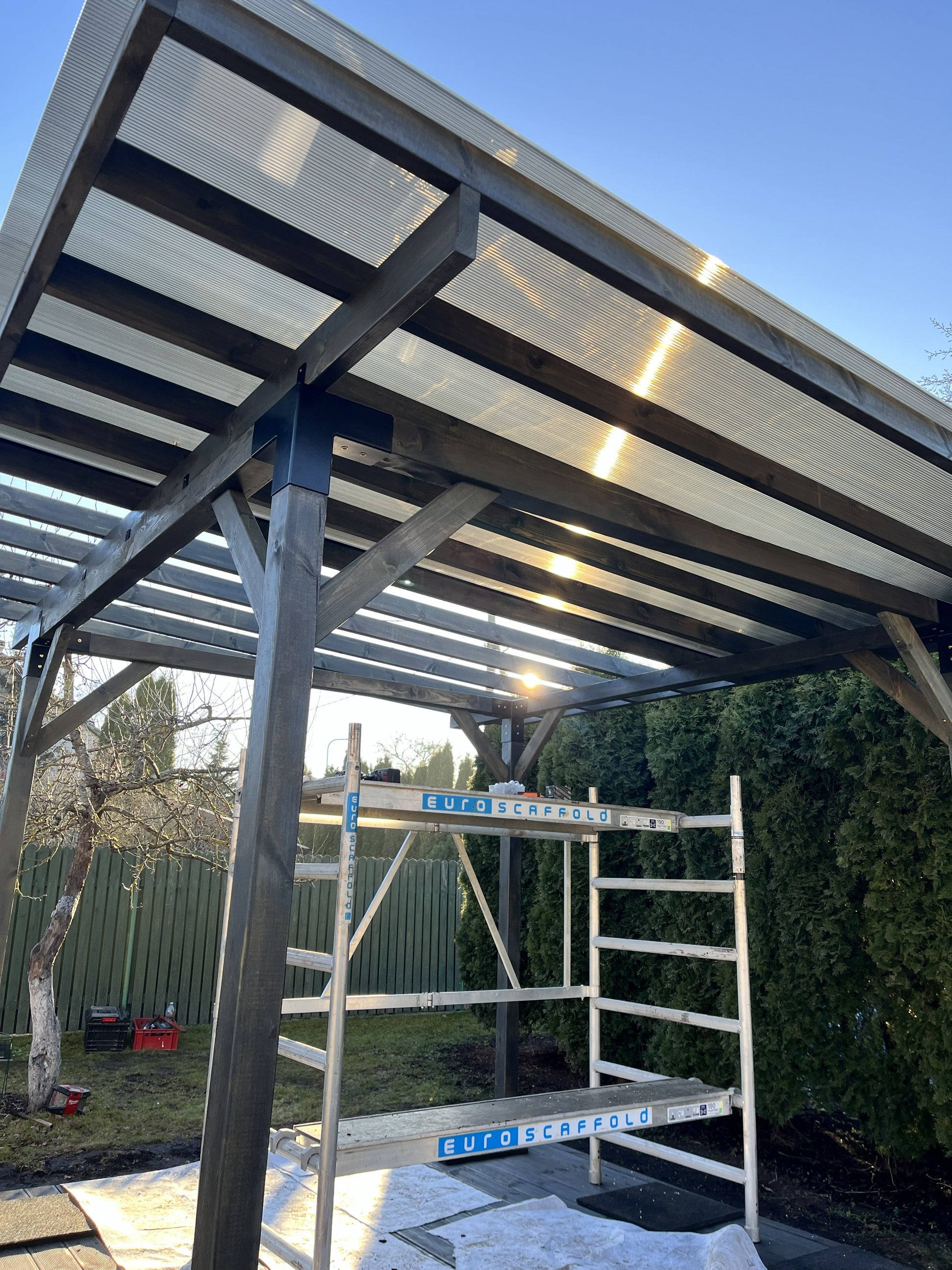 Terraces brand 3x3 meter terrace deck with canopy, showing wooden flooring and fabric roof in outdoor setting.
