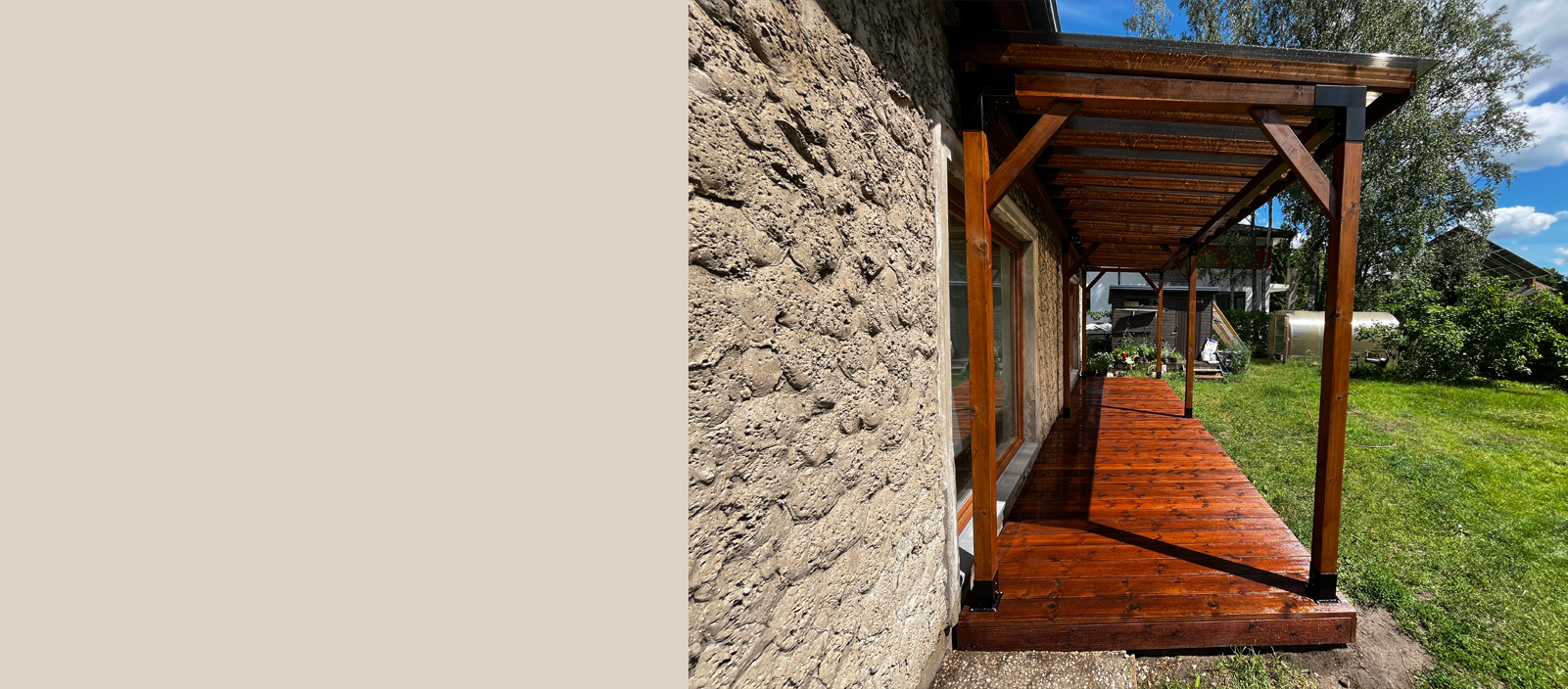 Wooden deck with a stone wall and garden in the backgroundslider_item_PeWgbK