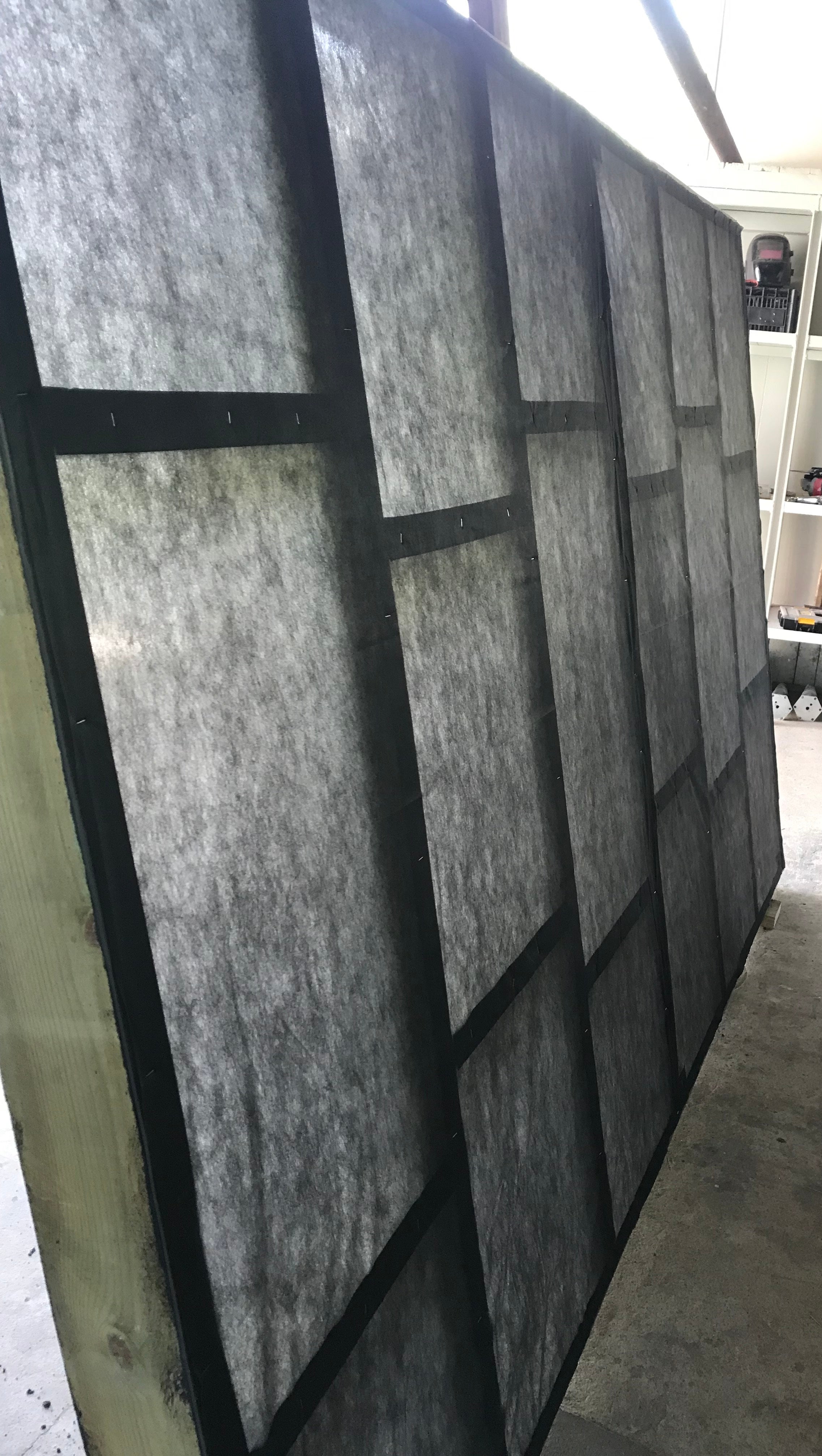 Textured wall panels with geometric design in a room setting