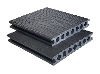 Two dark gray composite decking boards stacked on a white background