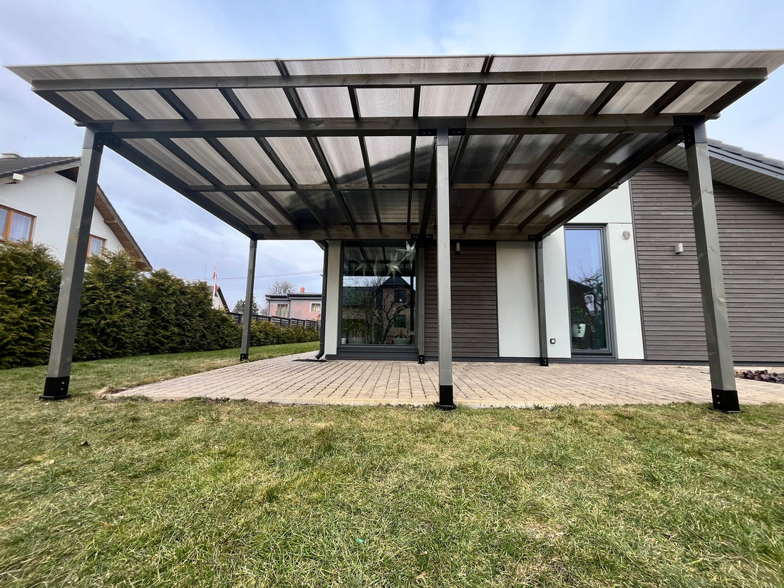 Modern carport attached to a house with a clear sky background